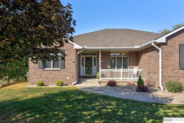 view of front of property with a front lawn and a porch