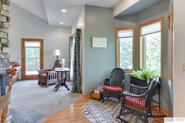 sitting room featuring wood-type flooring and a fireplace