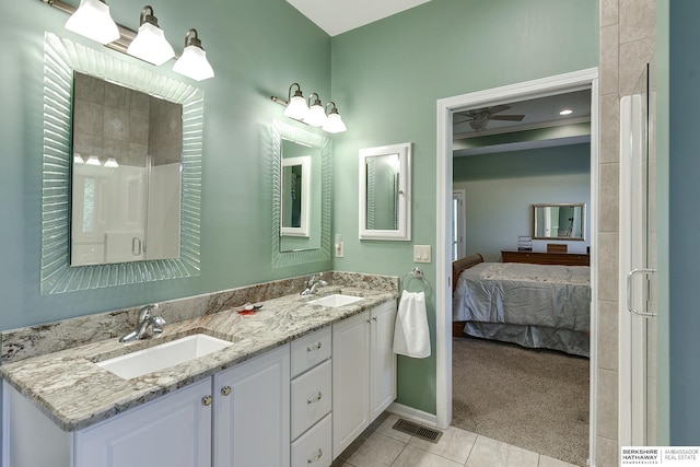 bathroom featuring vanity, an enclosed shower, tile patterned floors, and ceiling fan