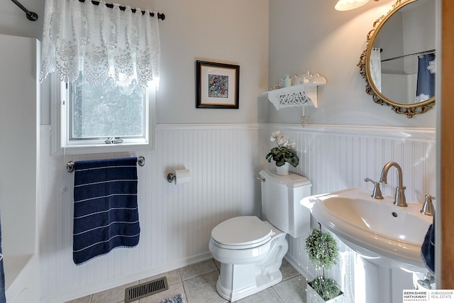 bathroom with tile patterned floors, toilet, and sink