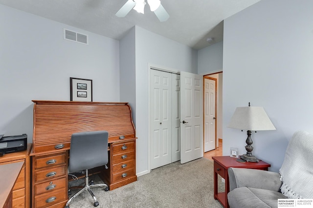 office area featuring light colored carpet and ceiling fan