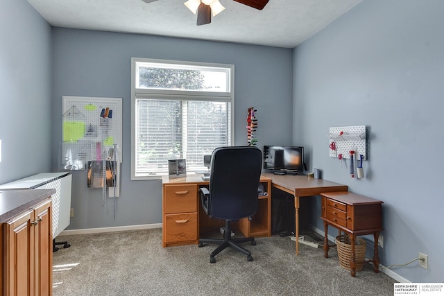 office with ceiling fan, light colored carpet, and a textured ceiling