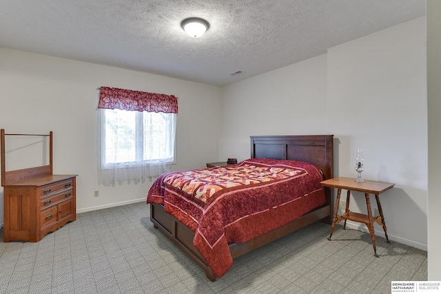 bedroom featuring a textured ceiling