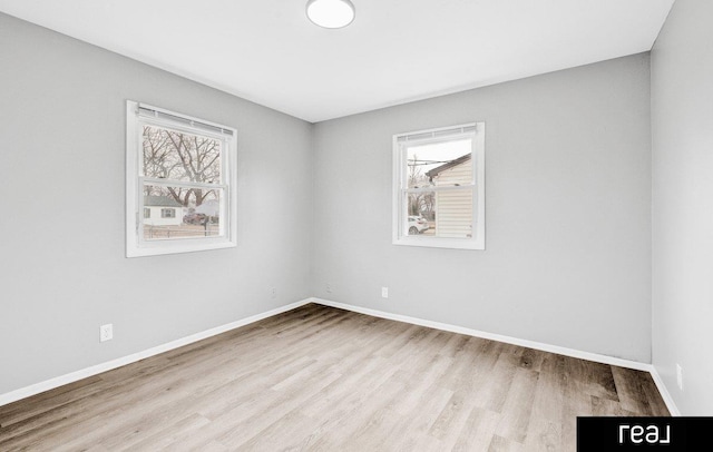 unfurnished room featuring light hardwood / wood-style floors