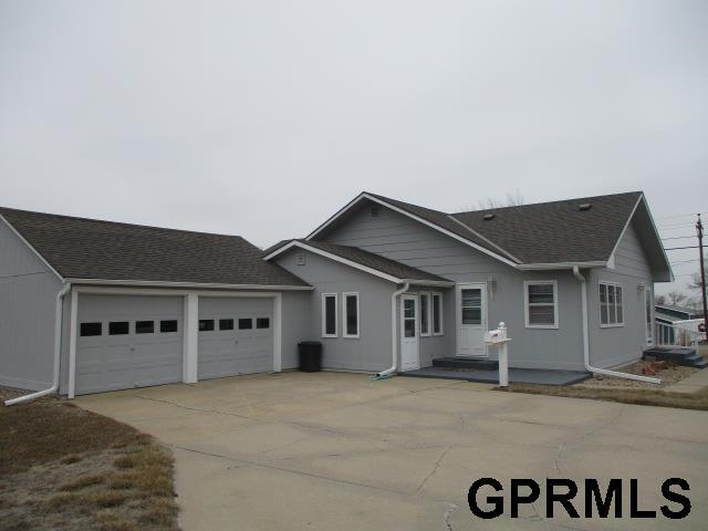 ranch-style home featuring a garage