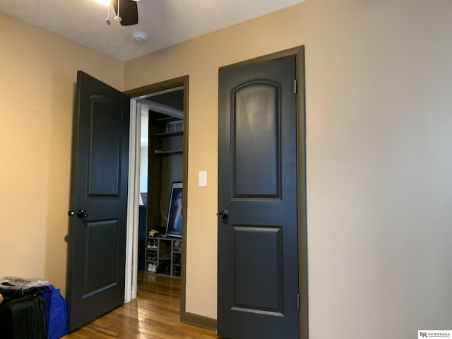 interior space with hardwood / wood-style floors and ceiling fan