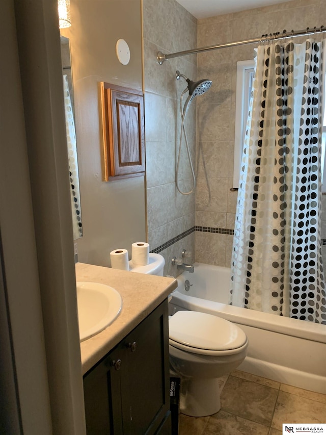 full bathroom featuring tile patterned floors, vanity, shower / tub combo with curtain, and toilet