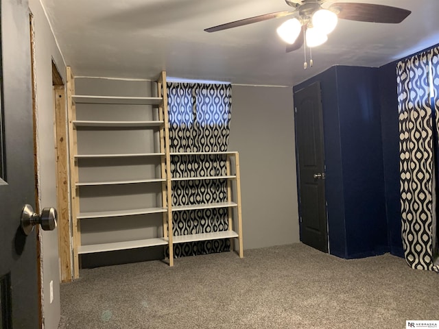 walk in closet featuring ceiling fan and carpet floors