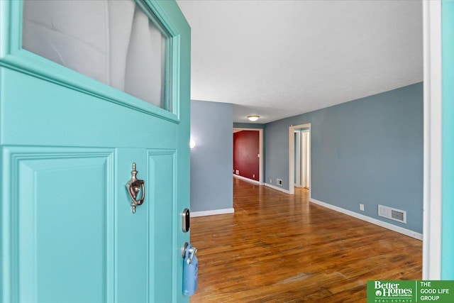 entryway with dark hardwood / wood-style floors