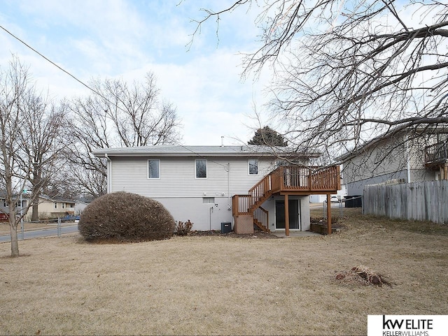 back of house featuring cooling unit, a lawn, and a deck