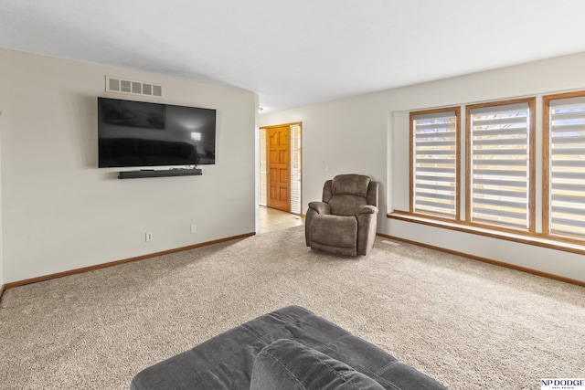 living area featuring light colored carpet