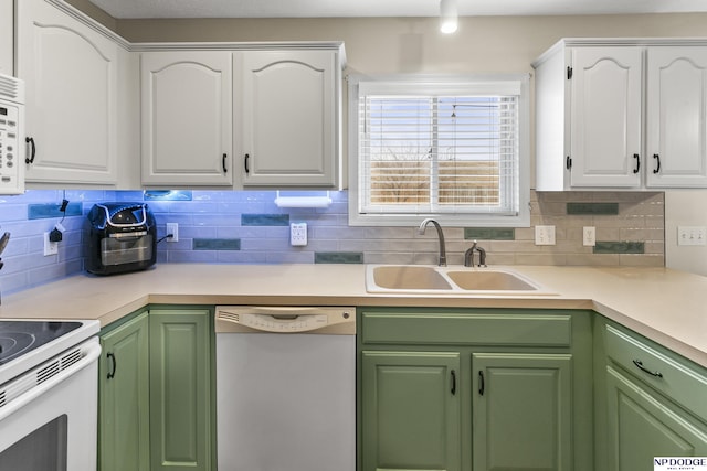 kitchen with sink, white cabinets, decorative backsplash, green cabinets, and white appliances