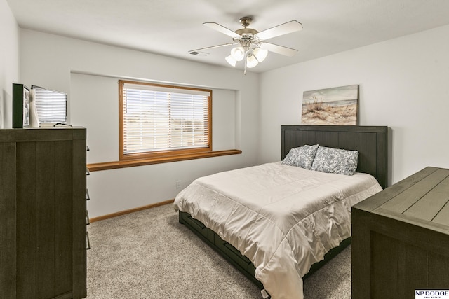 bedroom with light colored carpet and ceiling fan