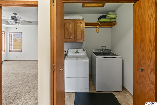 laundry room with cabinets, ceiling fan, light colored carpet, and independent washer and dryer