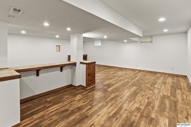 basement featuring hardwood / wood-style floors