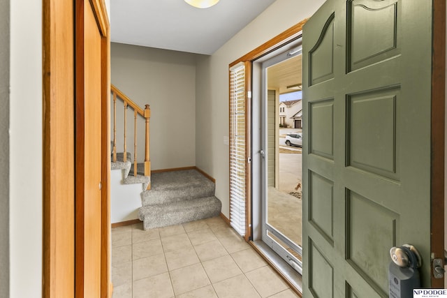 foyer with light tile patterned flooring