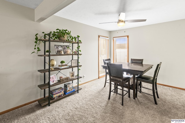 dining room featuring carpet flooring and ceiling fan