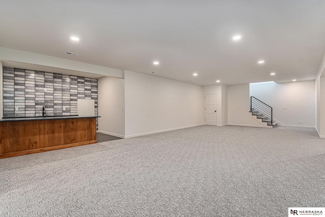 basement featuring carpet flooring