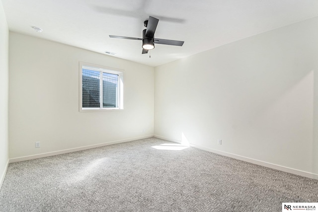 carpeted empty room with ceiling fan