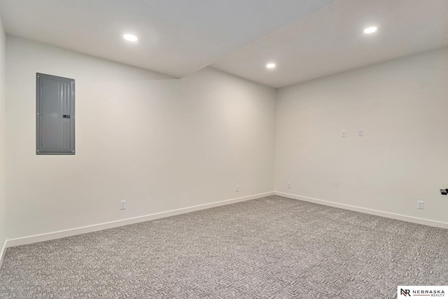 carpeted empty room featuring electric panel