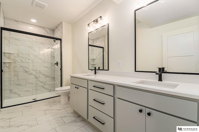 bathroom with vanity, toilet, and walk in shower