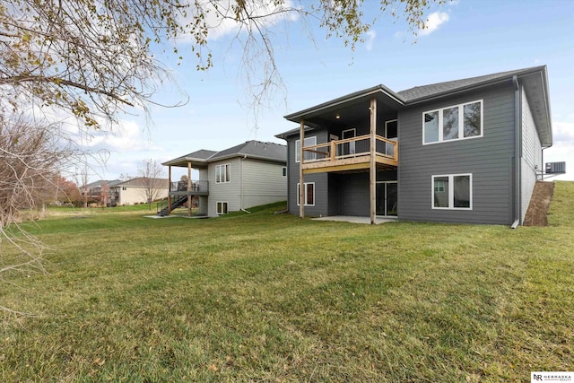 back of house with a lawn, stairway, and cooling unit