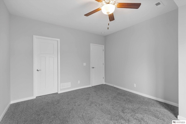 unfurnished bedroom featuring carpet flooring, visible vents, and baseboards