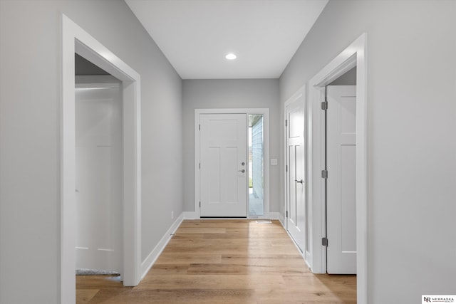 entrance foyer with light wood-type flooring, baseboards, and recessed lighting