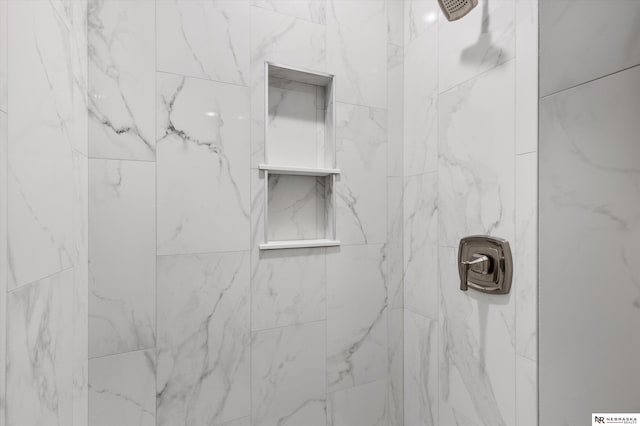 details with a tile shower