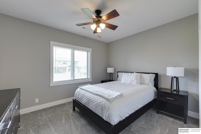 bedroom featuring ceiling fan and dark colored carpet