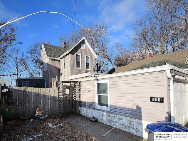 view of side of home with a garage