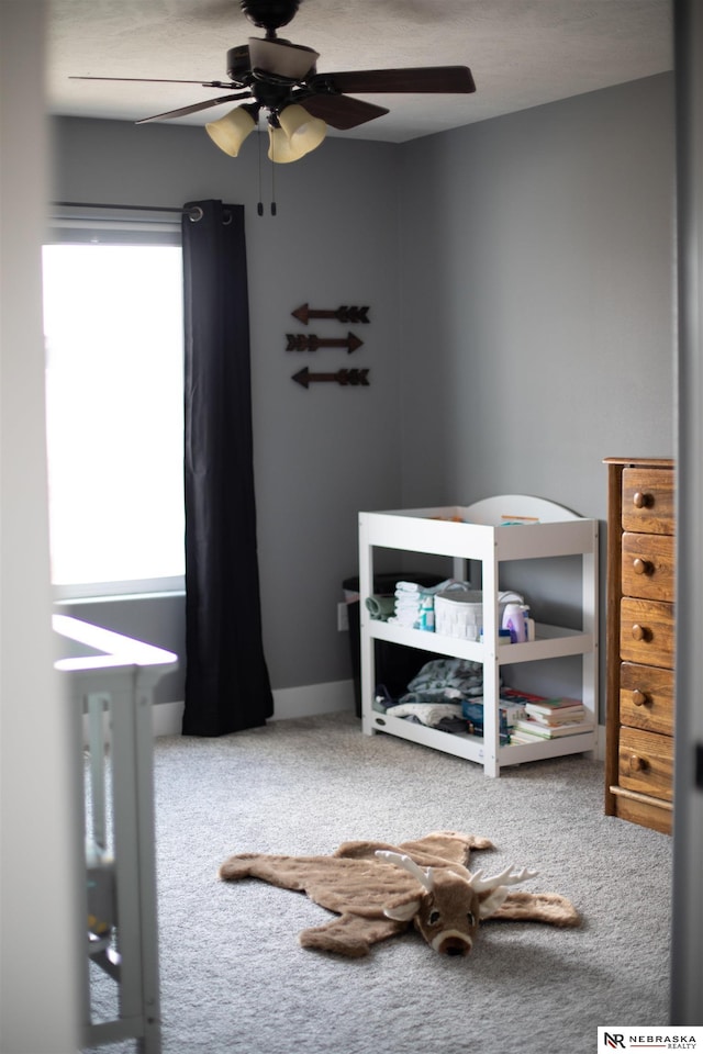 bedroom featuring ceiling fan and carpet floors