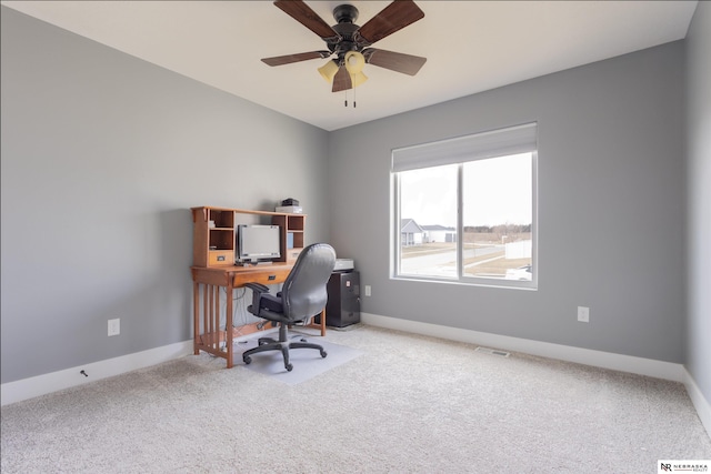 office area with carpet floors and ceiling fan