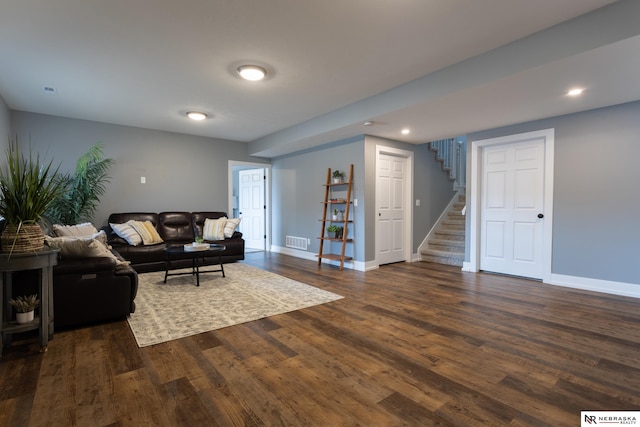 living room with dark hardwood / wood-style floors