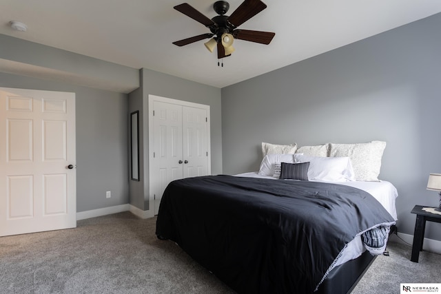 carpeted bedroom featuring ceiling fan and a closet