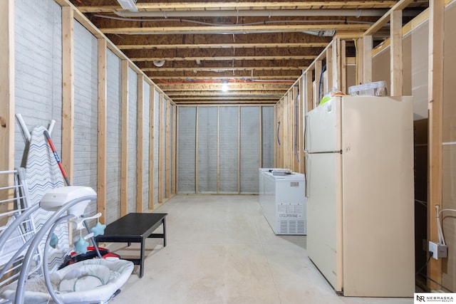 basement featuring white fridge