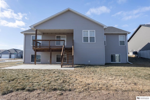 back of house with a yard and a patio area