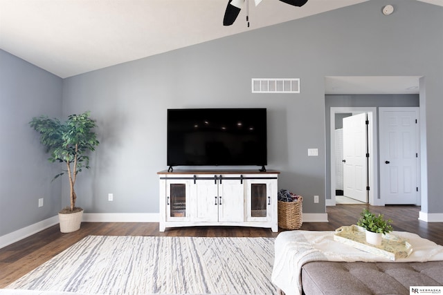 living room featuring hardwood / wood-style flooring, lofted ceiling, and ceiling fan