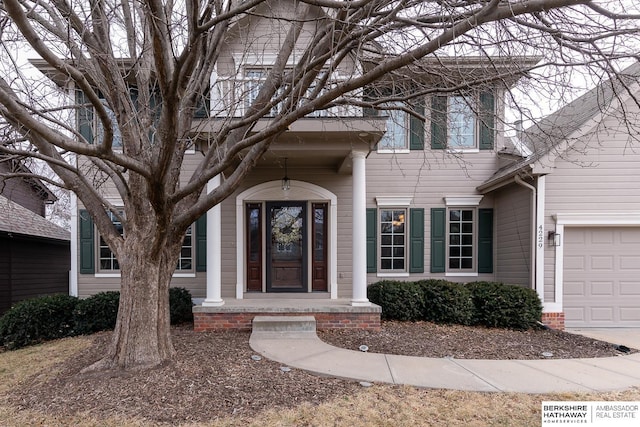 entrance to property featuring a garage