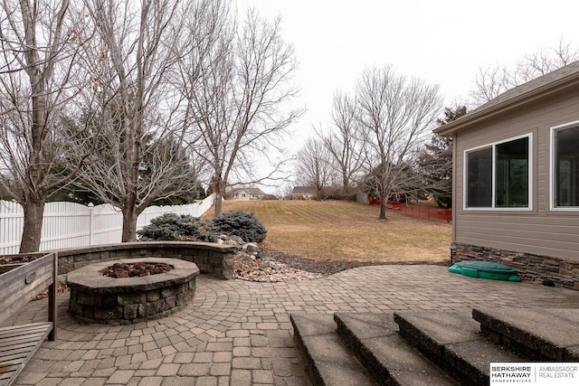 view of patio with an outdoor fire pit