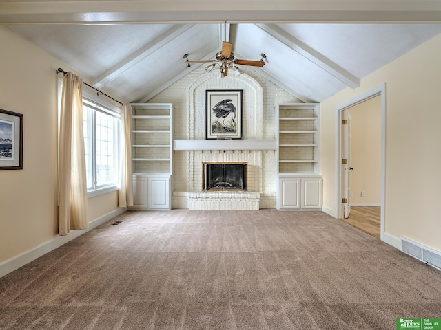 unfurnished living room with baseboards, visible vents, light colored carpet, lofted ceiling with beams, and a fireplace