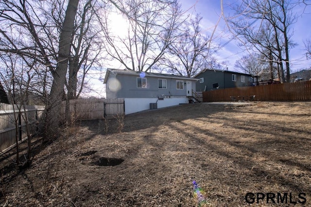 rear view of property featuring cooling unit