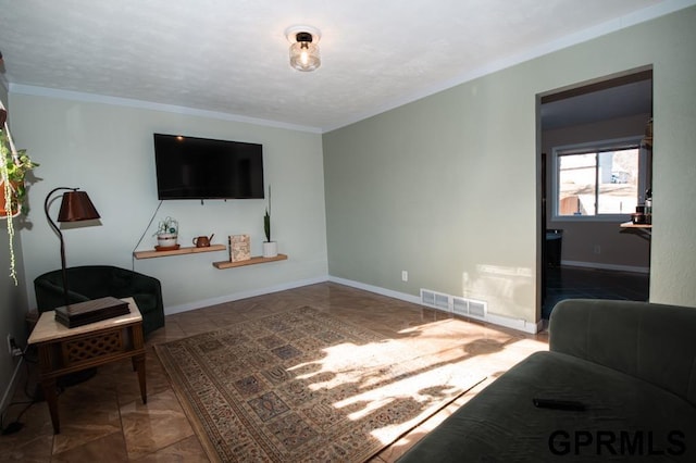 living room featuring crown molding