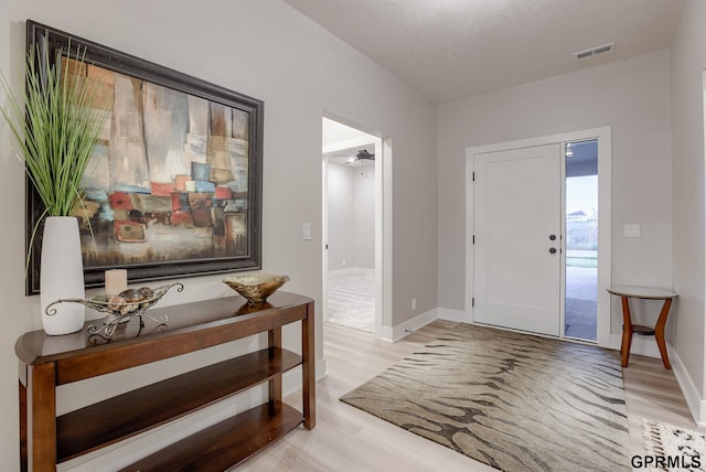 entryway with light hardwood / wood-style floors