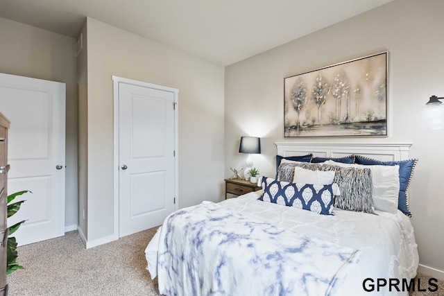 bedroom featuring light colored carpet