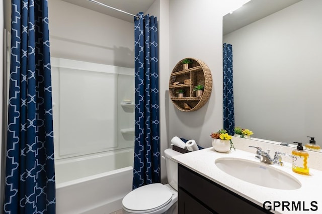 full bathroom with vanity, toilet, and shower / tub combo