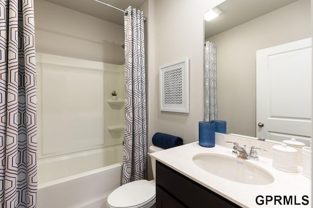 full bathroom with vanity, shower / tub combo with curtain, and toilet