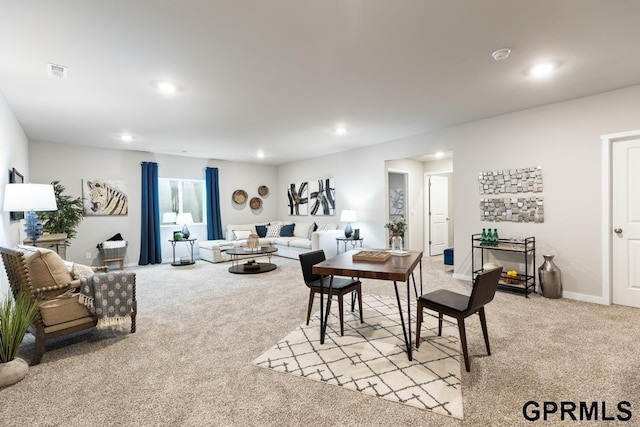 carpeted living room featuring a fireplace