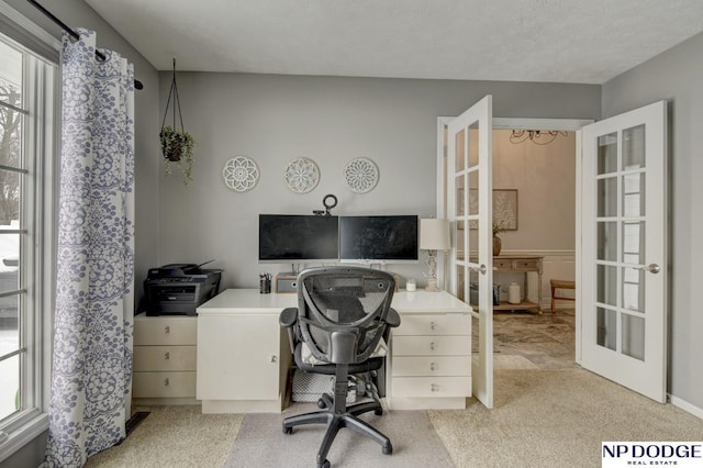 home office featuring light colored carpet and french doors