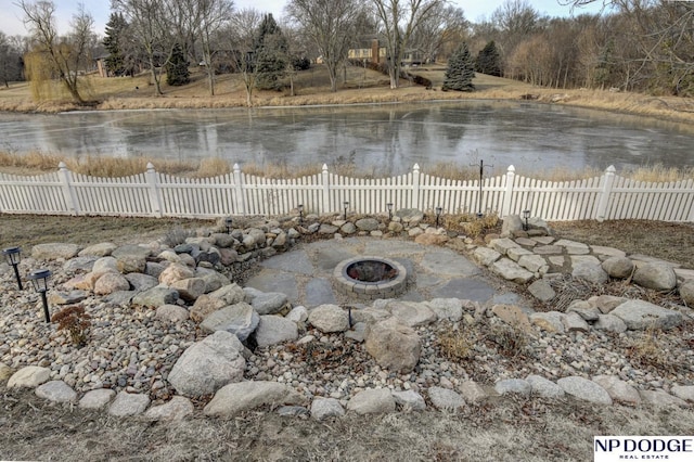 property view of water with a fire pit